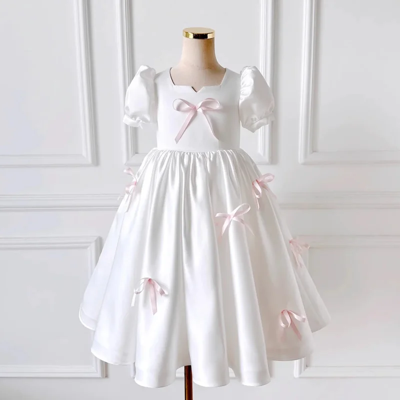 Rochie albă eleganta pentru fete, cu fundite roz si maneca bufanta din tafta - Cassandra
