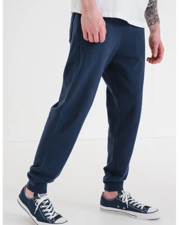 Pantaloni de trening cu croiala conica si aplicatie logo, Bleumarin