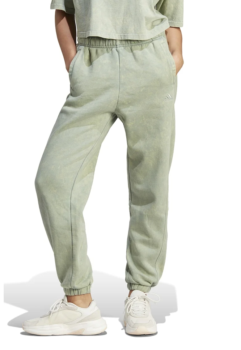 Pantaloni sport cu aspect deteriorat