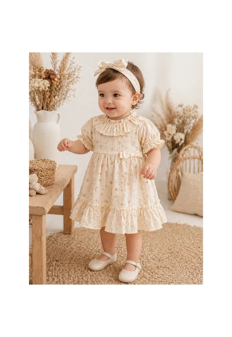 Rochita fetite crem din bumbac cu imprimeu floral si volane elegante
