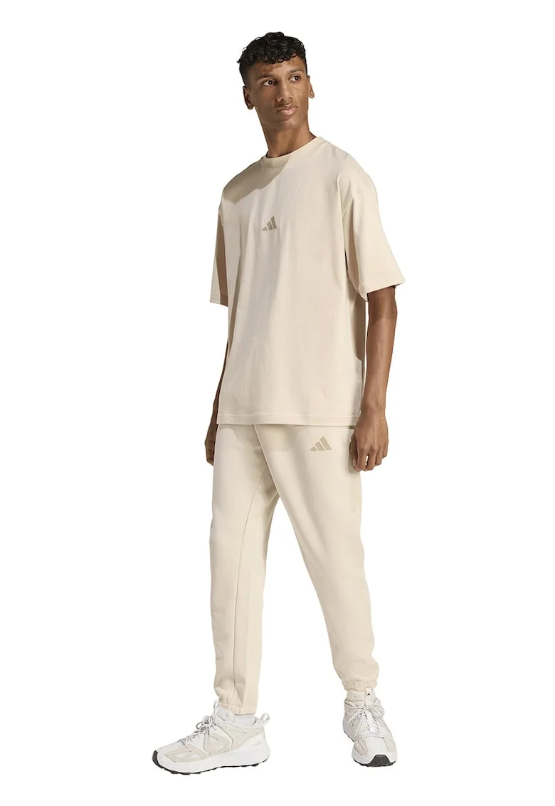 Pantaloni de trening conici cu buzunare laterale, Crem